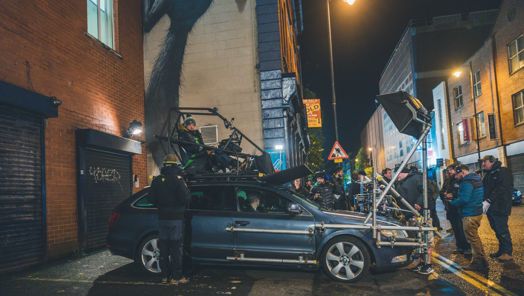 On location of Blue Lights season 2, production crew rig lights to film a car scene