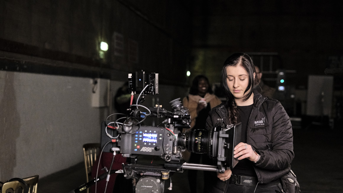 Camera trainee working a camera