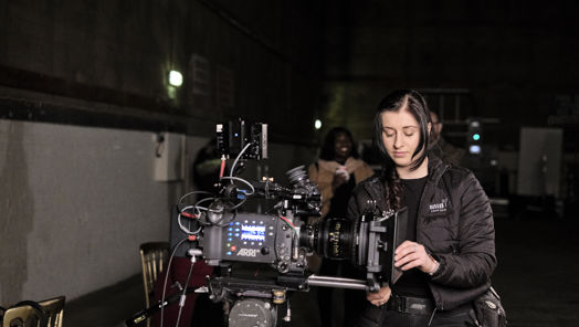 Camera trainee working a camera