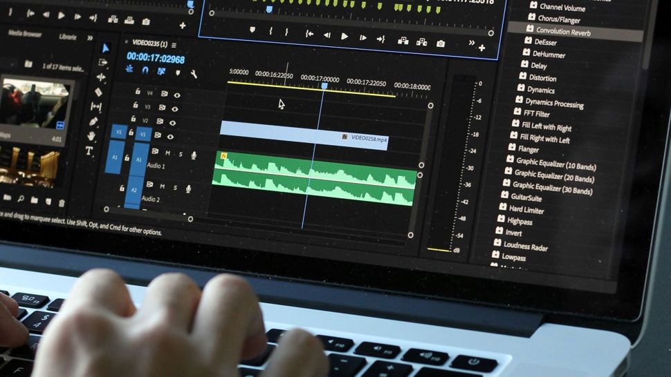 Closeup of someone editing a video in a video editing software on a laptop